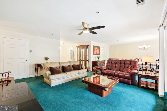 living room with visible vents, dark carpet, and ceiling fan with notable chandelier