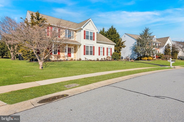 view of front of property with a front lawn