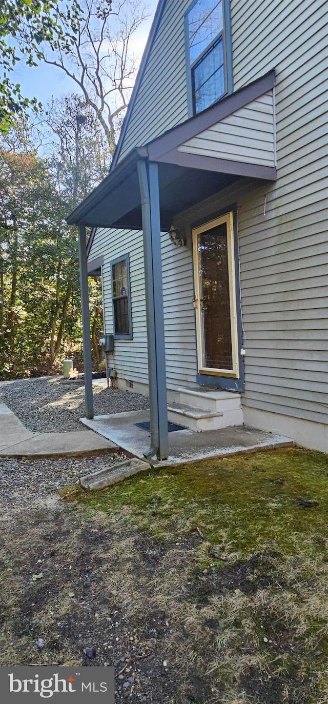 entrance to property featuring a patio