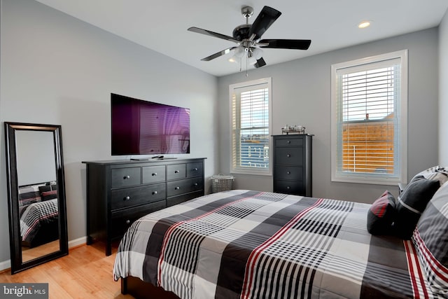 bedroom with recessed lighting, light wood-type flooring, a ceiling fan, and baseboards