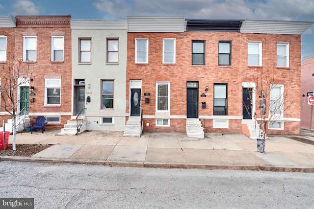 multi unit property featuring brick siding