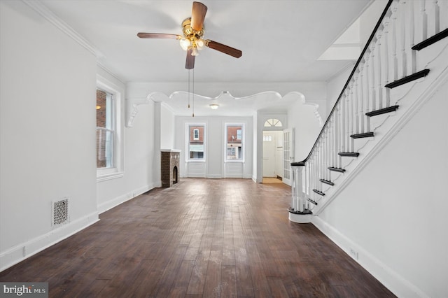 entrance foyer featuring ornamental molding, hardwood / wood-style floors, and ceiling fan