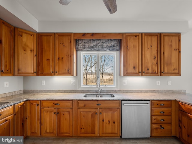 kitchen featuring dishwasher, light countertops, a sink, and brown cabinets