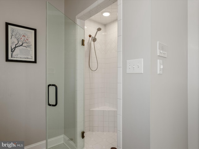 bathroom featuring a shower stall