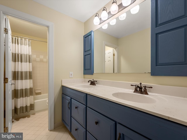 full bathroom featuring double vanity, shower / tub combo, a sink, and tile patterned floors