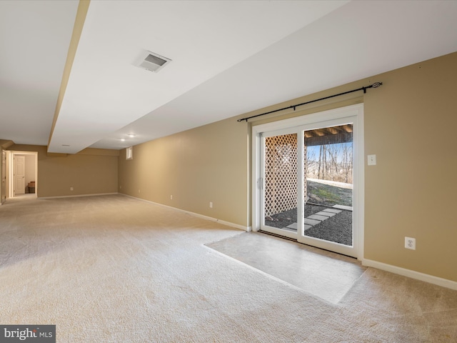 unfurnished room featuring baseboards, visible vents, and light colored carpet