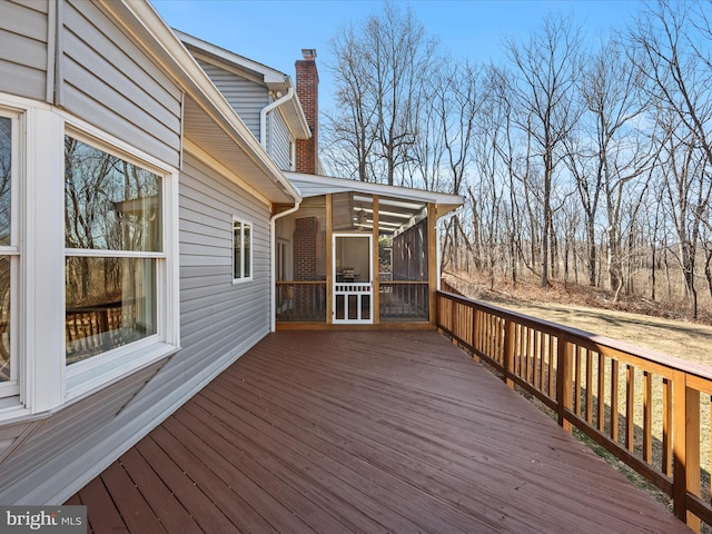 wooden terrace featuring a sunroom