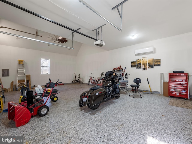 garage featuring a wall mounted AC and a garage door opener