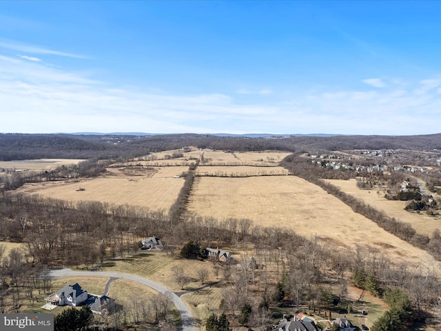 birds eye view of property with a rural view