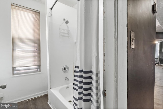 bathroom featuring shower / tub combo with curtain and wood-type flooring