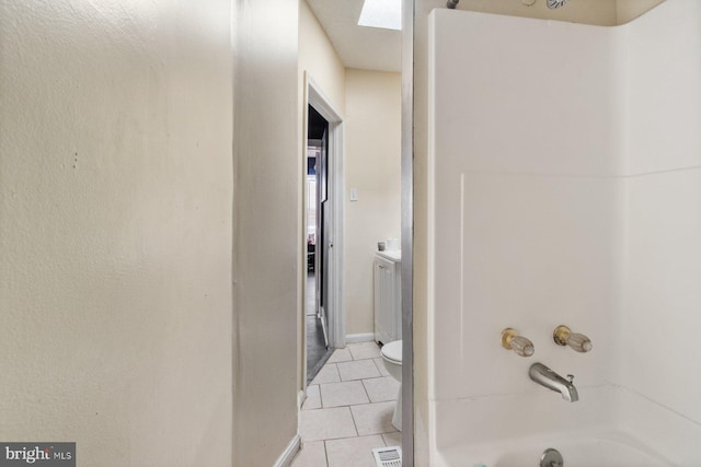 full bathroom with tile patterned floors, toilet, vanity, and shower / washtub combination