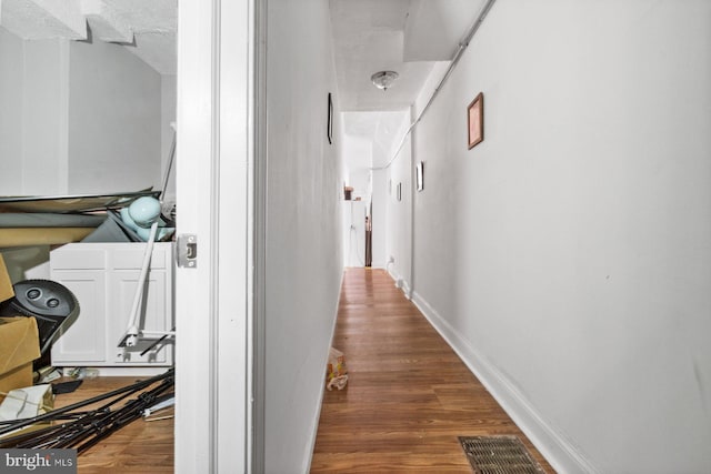 corridor featuring dark wood-type flooring