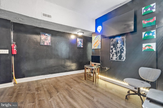 living area with hardwood / wood-style flooring