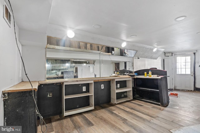 kitchen featuring lofted ceiling and wood-type flooring