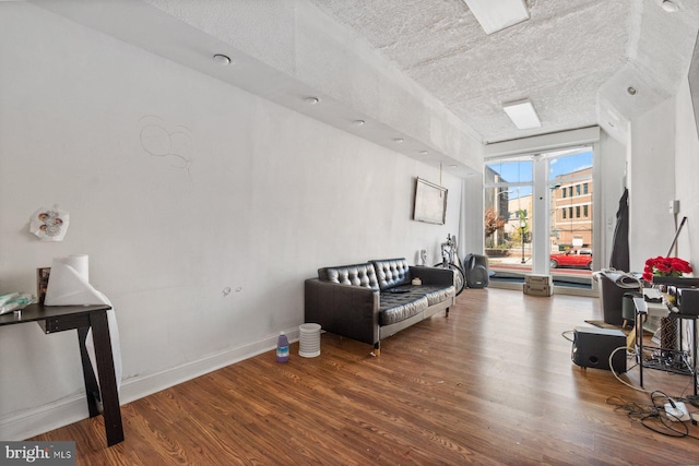 sitting room with hardwood / wood-style floors