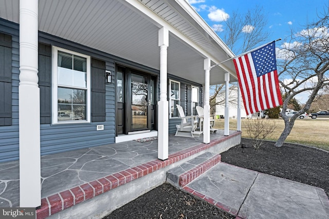 doorway to property featuring a porch