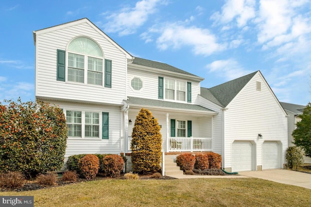 view of front of home with a porch, roof with shingles, driveway, and a front lawn