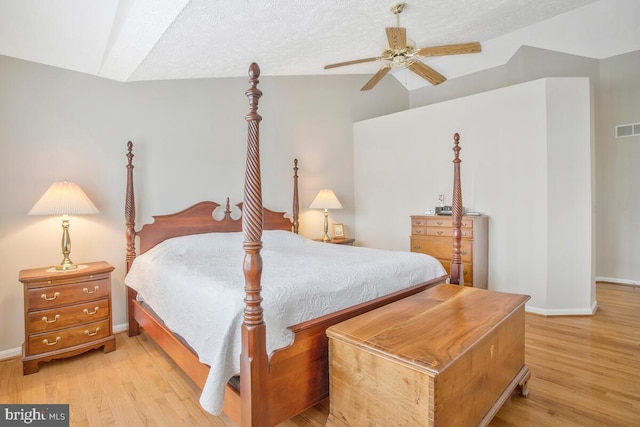 bedroom featuring light wood-type flooring, visible vents, and baseboards