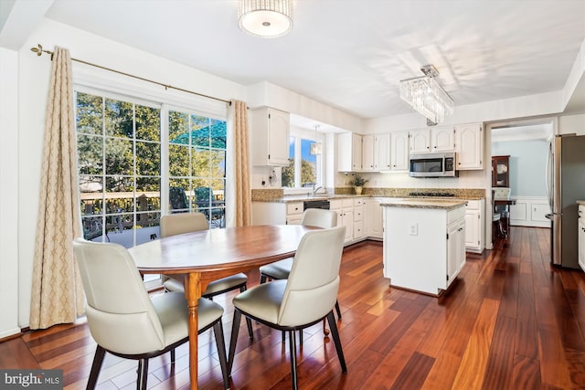 dining room with dark wood-style flooring