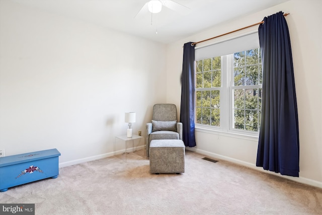 unfurnished room with carpet flooring, visible vents, and a healthy amount of sunlight