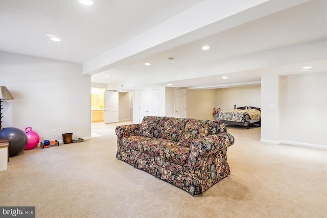 living area featuring baseboards, recessed lighting, and light colored carpet