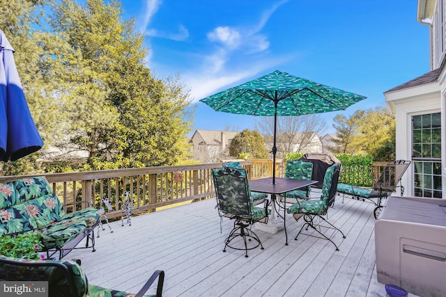 deck with outdoor dining area