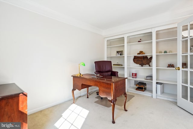 carpeted office featuring baseboards, ornamental molding, and french doors