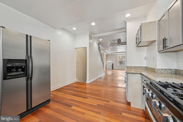 kitchen with appliances with stainless steel finishes, light wood-type flooring, ceiling fan, and recessed lighting