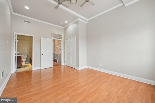 unfurnished bedroom with light wood-style flooring, visible vents, and baseboards