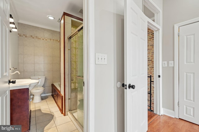 bathroom featuring tile patterned flooring, toilet, recessed lighting, vanity, and tile walls