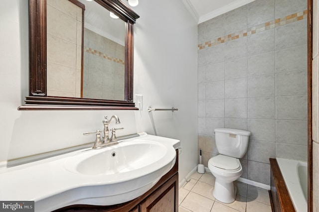 bathroom with toilet, ornamental molding, tile patterned floors, a washtub, and vanity