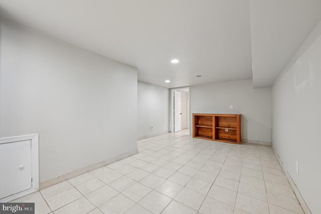 unfurnished room featuring light tile patterned floors, baseboards, and recessed lighting