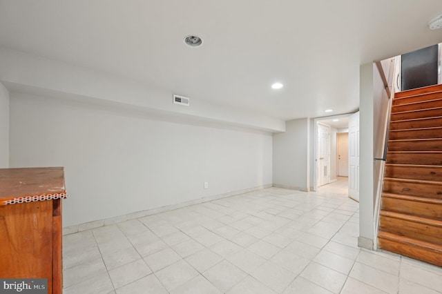 interior space with light tile patterned floors, recessed lighting, visible vents, stairway, and baseboards