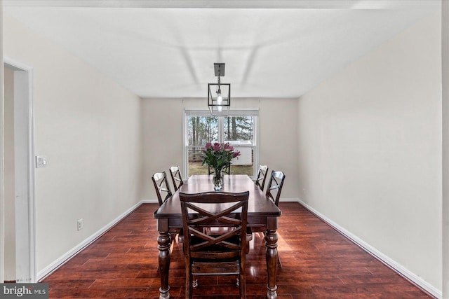 dining space featuring dark hardwood / wood-style flooring