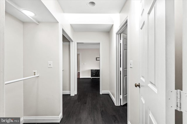 corridor featuring dark hardwood / wood-style floors