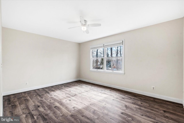 empty room featuring dark hardwood / wood-style floors and ceiling fan