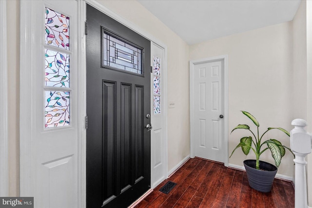 foyer with dark hardwood / wood-style floors