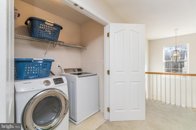 laundry room featuring washing machine and clothes dryer