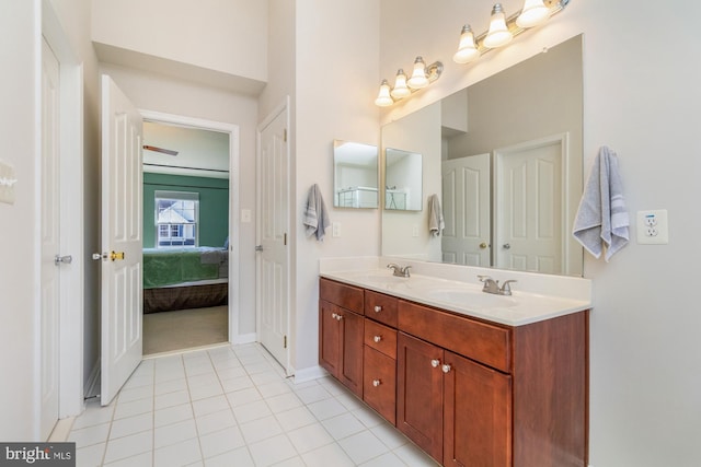 bathroom with tile patterned floors and vanity