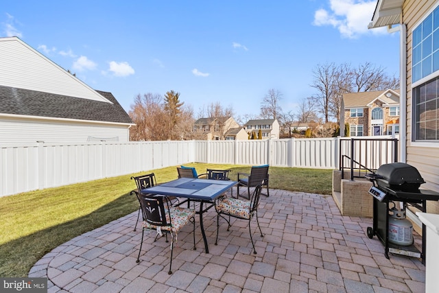 view of patio featuring a grill