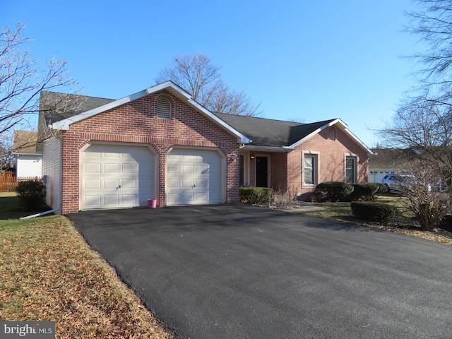 ranch-style house featuring a garage