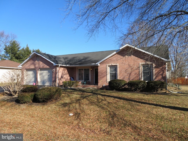 ranch-style home with a front lawn and a garage