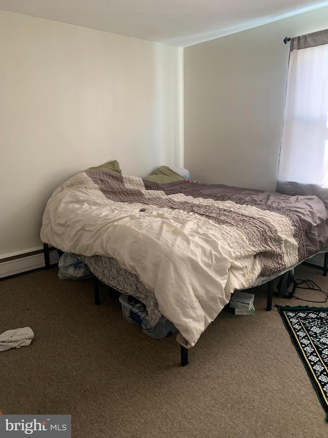 bedroom featuring carpet flooring and baseboard heating