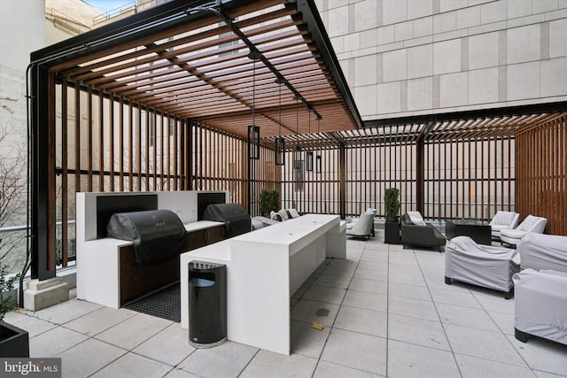 view of patio / terrace with an outdoor kitchen, a pergola, outdoor lounge area, and area for grilling