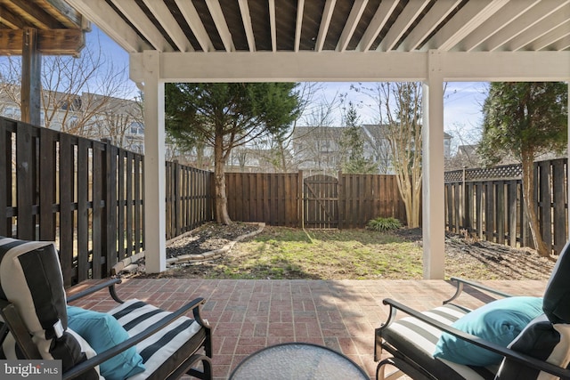 view of patio / terrace featuring a fenced backyard and a gate