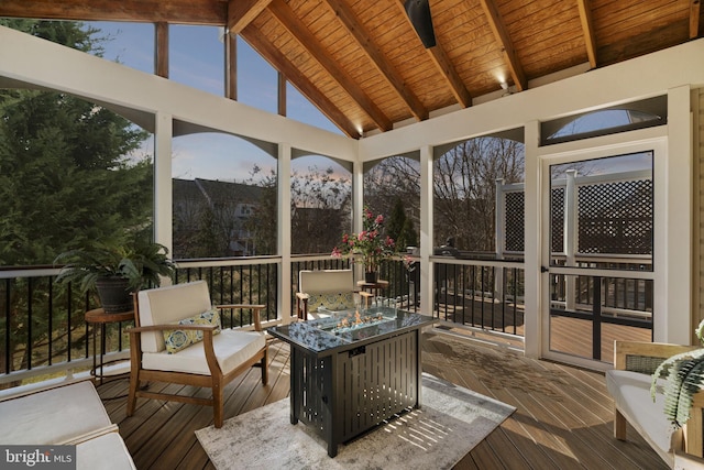 sunroom with vaulted ceiling with beams and wooden ceiling