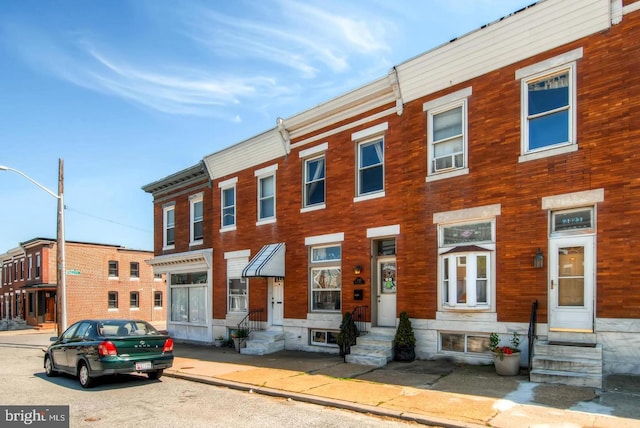 townhome / multi-family property featuring entry steps