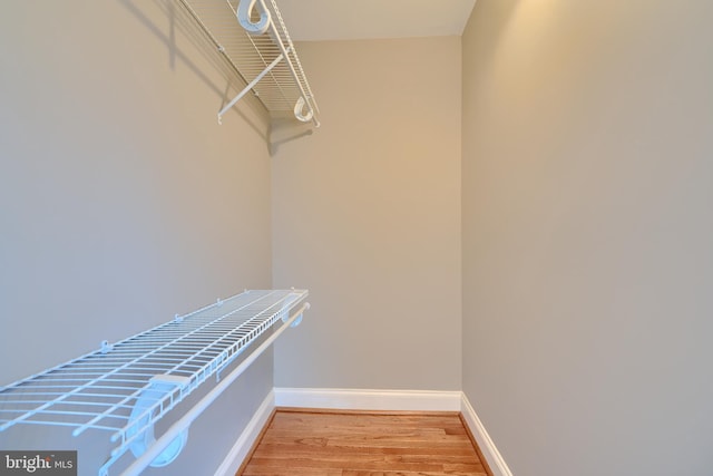 spacious closet with light wood-style floors