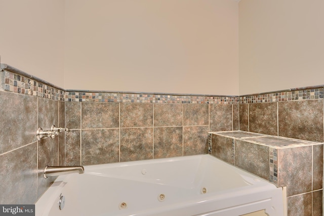 bathroom with a whirlpool tub