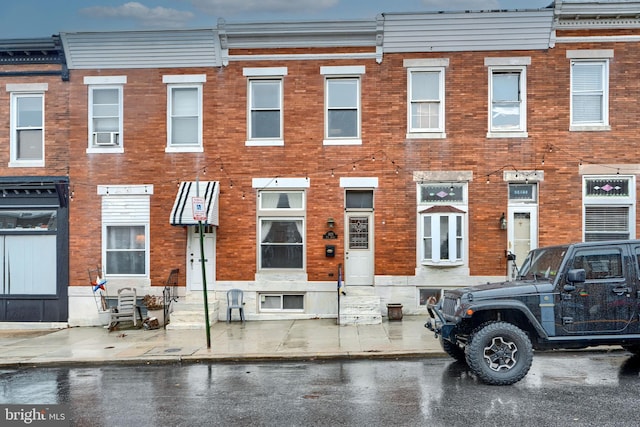 townhome / multi-family property featuring brick siding